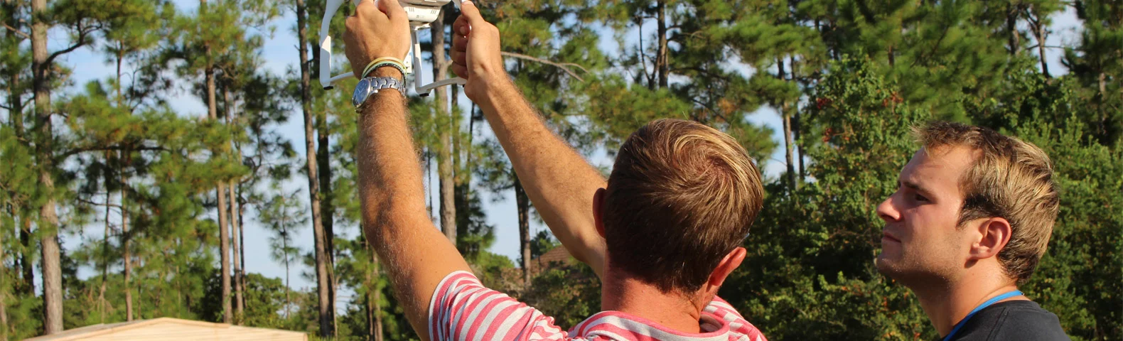Mario Werth teaching pilot in training, Michael Brown, the ropes of operating a drone.